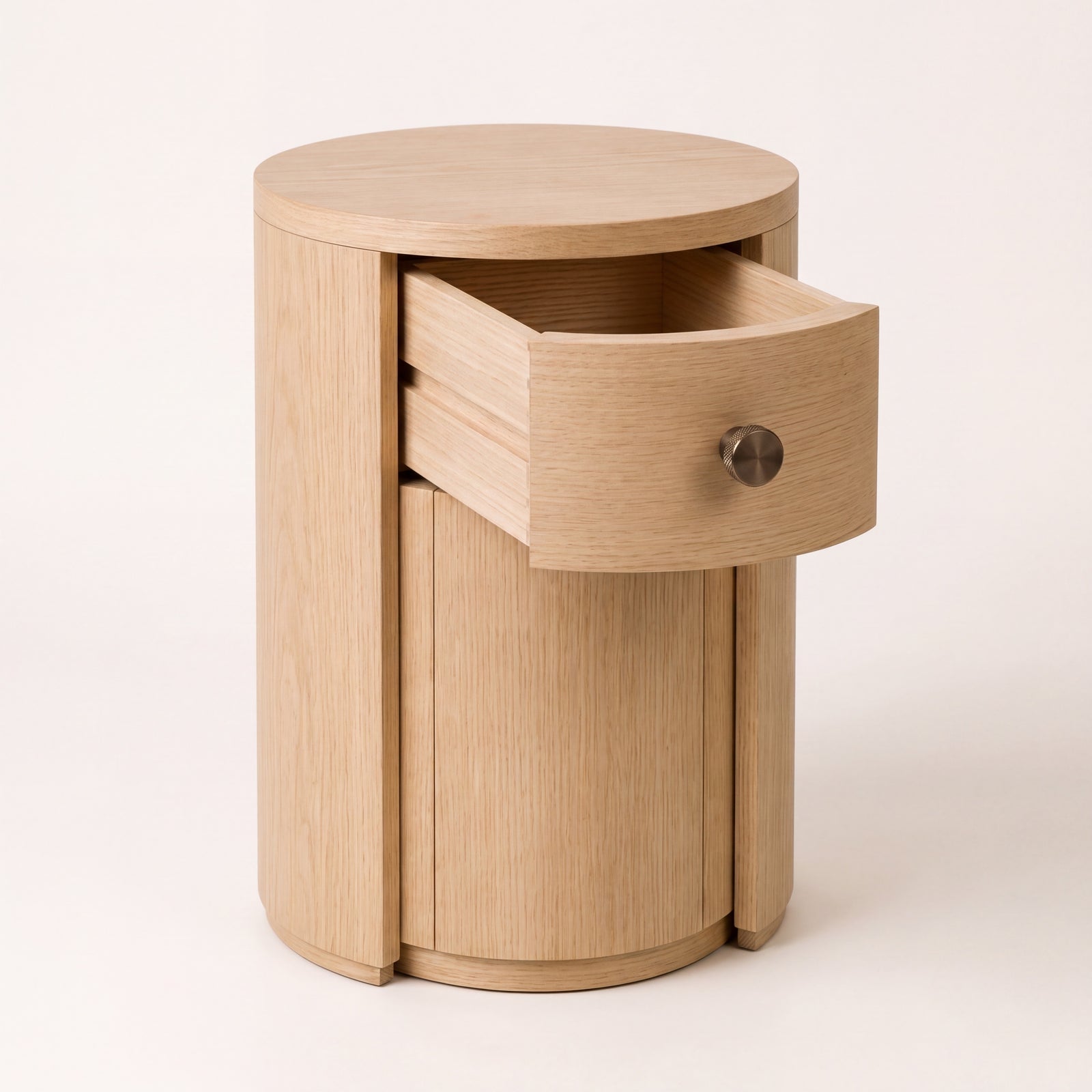 Natural ash wood side table with door open showing the hidden drawer interior.
