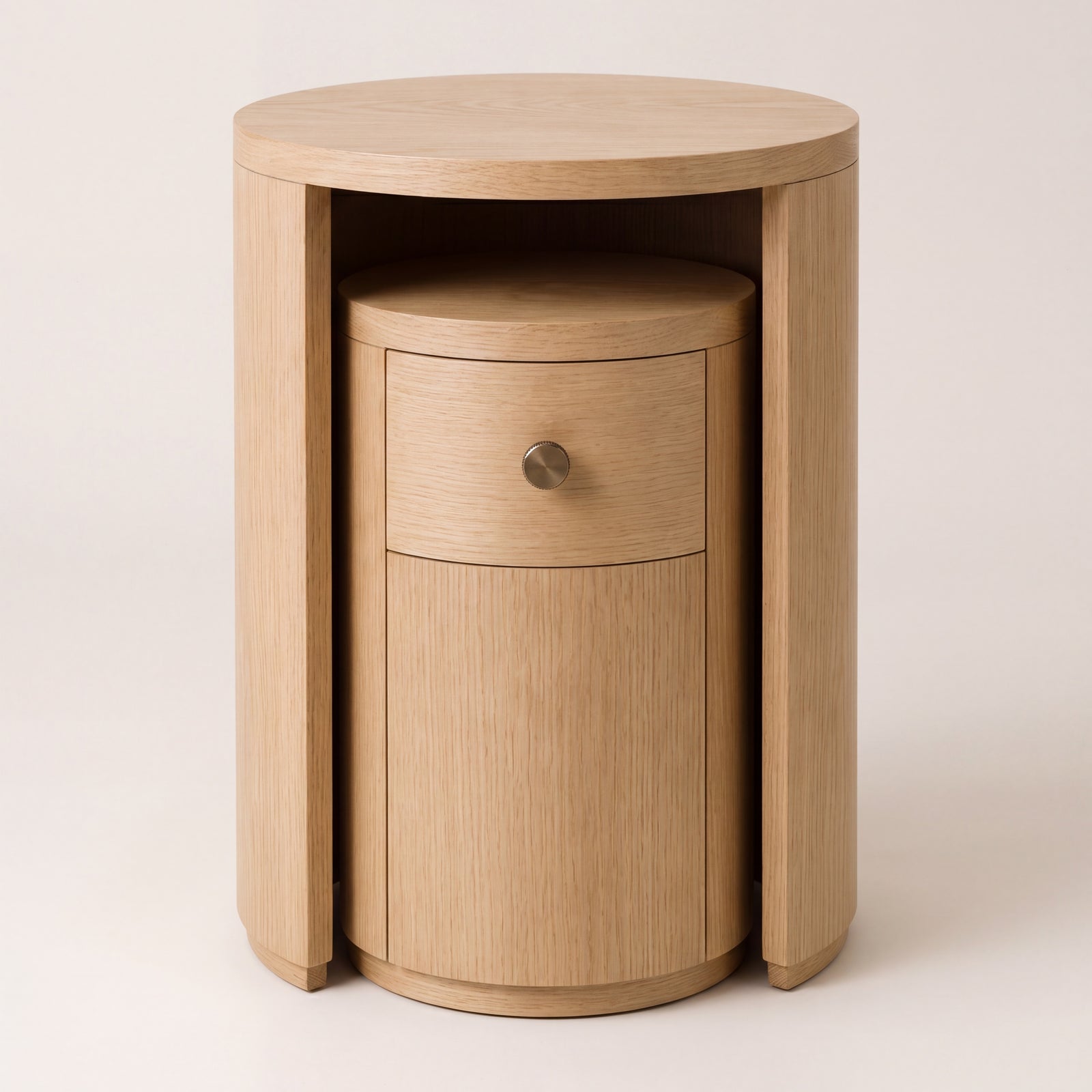 Nested natural ash wood side tables in a light satin finish.