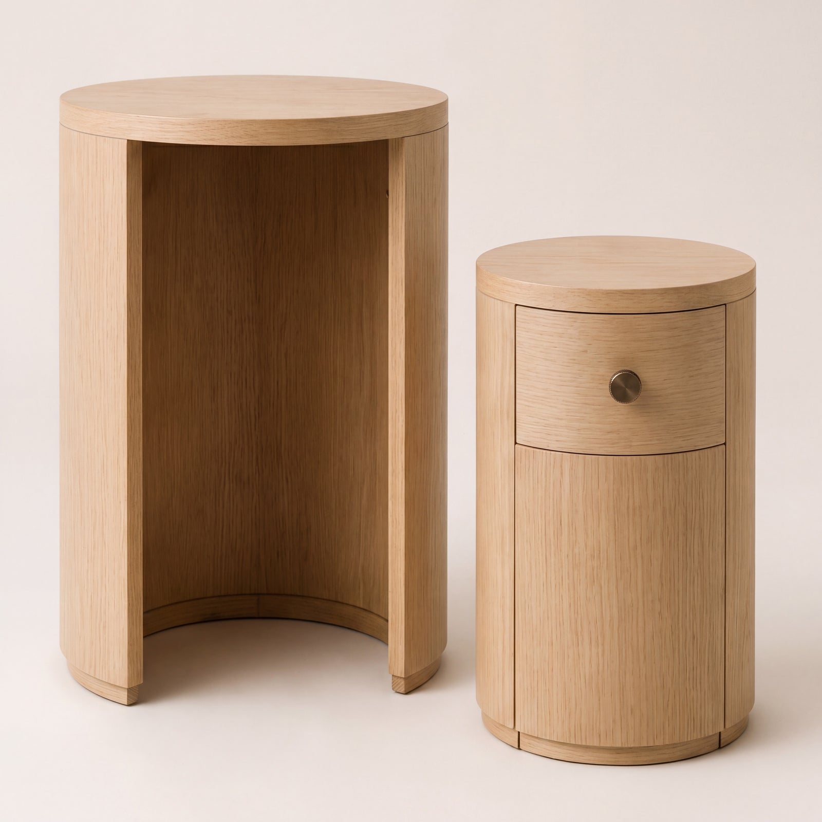 Natural ash wood nesting end tables separated to show individual round shapes.