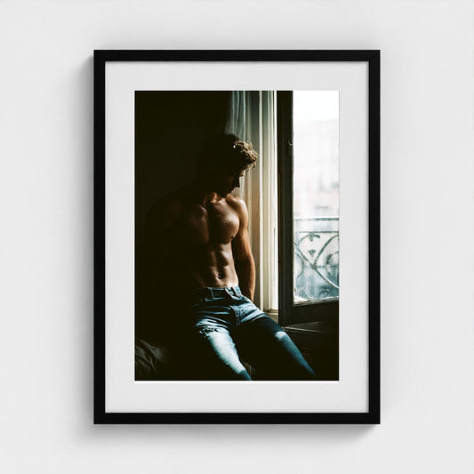 Contemplative Window Portrait in Denim and Soft Light