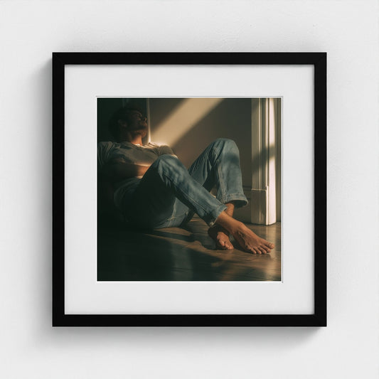 Contemplative Man in Sunlit Floor Portrait Study