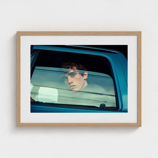 Contemplative Youth Portrait in Minimal Car Interior