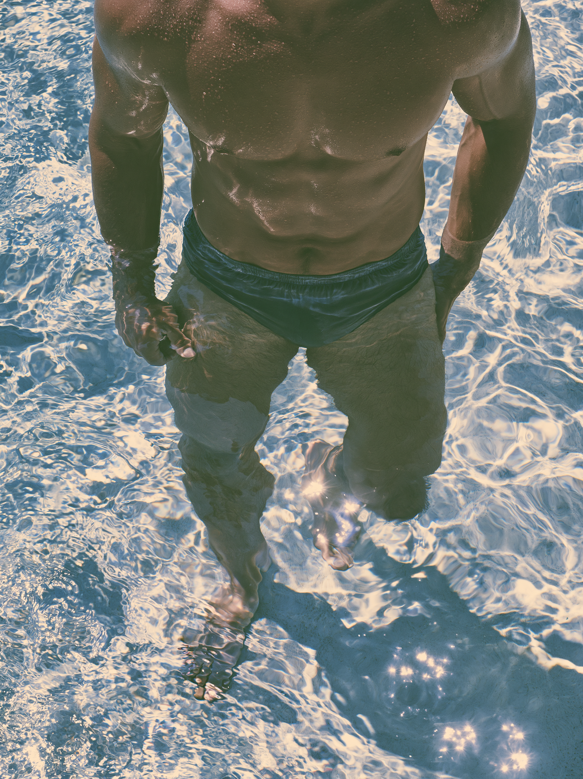 3D Source Artwork - Under Water Speedo male swimmer in sunlit blue water