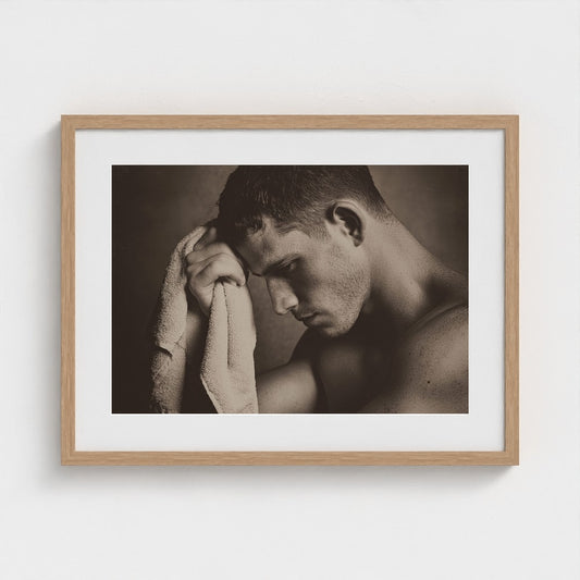 Contemplative Sepia Portrait With Towel and Soft Light