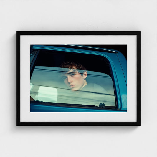 Contemplative Youth Portrait in Minimal Car Interior
